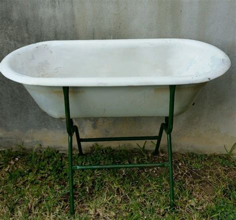 Water flows from a charming, vintage look faucet into 3 aged galvanized tubs resembling old washstands. ANTIQUE HUNGARY BABY PORCELAIN BATH TUB WITH METAL FOLDING ...