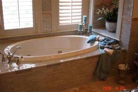 Garden tub w/access panel (60w x 37d x 27h) (clarion). Beautiful garden tub surrounded by tile with a tile chair ...