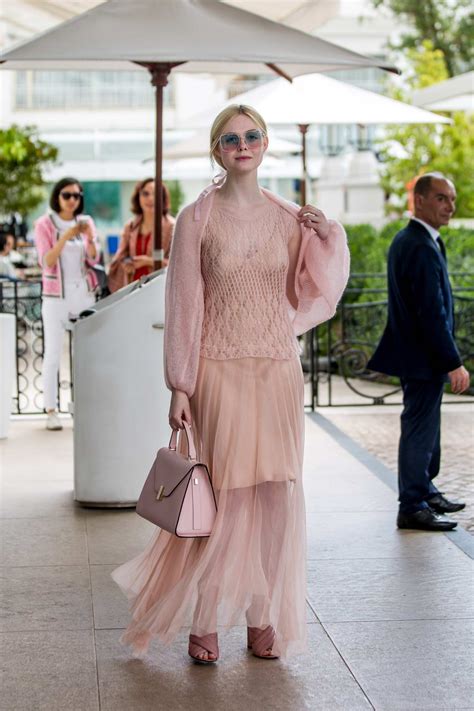 elle fanning looks pretty in a blush colored dress as she leaves the hotel martinez during the