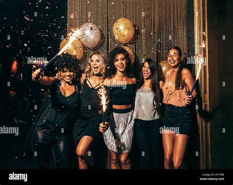 Shot Of Group Of Young Women Celebrating New Years Eve At The Pub