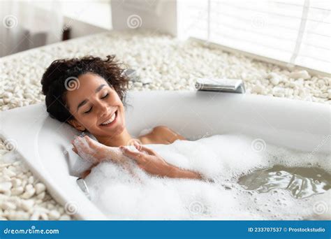 Relaxing Bath Happy Young Woman Lying In Bathtub With Closed Eyes Enjoying Beauty Ritual At