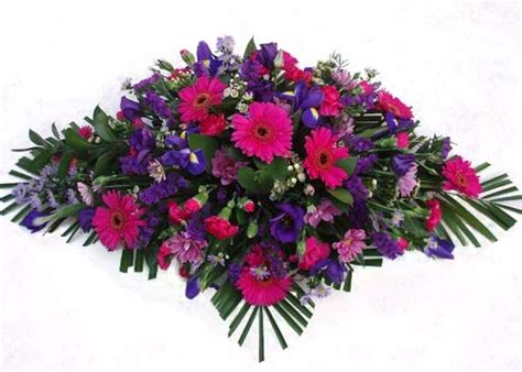 Let us deliver your funeral flowers or casket flowers directly to the mortuary so you don't worry. Funeral Flowers Cerise & Purple Spray