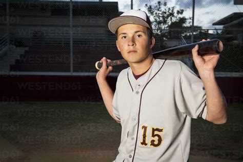 Portrait Of High School Baseball Player Holding His Bat Stock Photo
