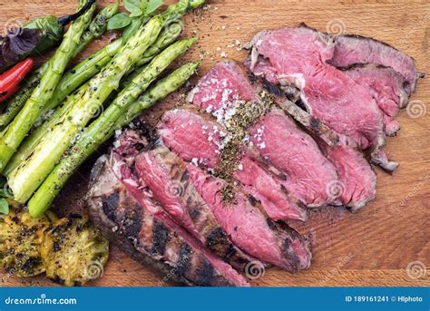 Traditional Barbecue Dry Aged Sliced Angus Roast Beef Steak With Green