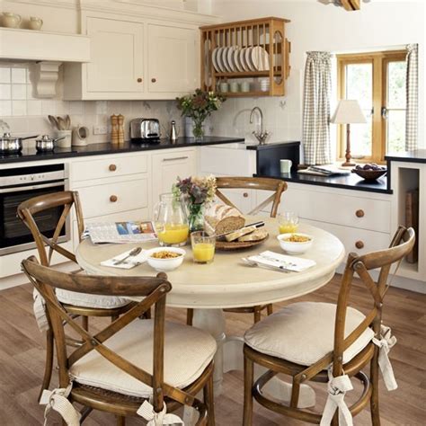 Country-style family kitchen with round table | Family ...