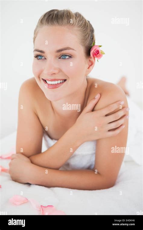 Pretty Blonde Lying On Massage Table With Petals Stock Photo Alamy