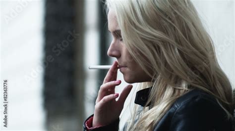 woman smoking a cigarette and coughing stock footage and royalty free videos on