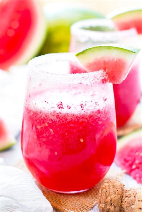 Two Glasses Filled With Watermelon Juice And Topped With A Slice Of