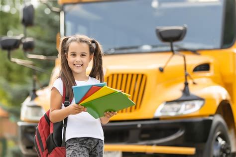 Free Photo Cute Girl With A Backpack Standing Near Bus Going To