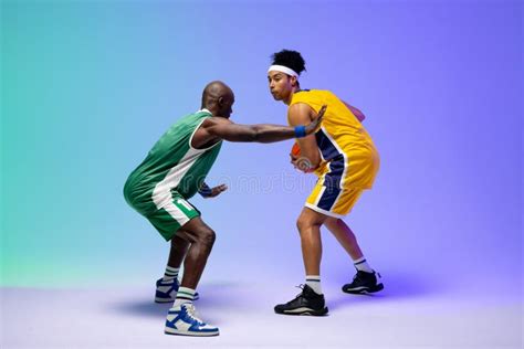 Image Of Two Diverse Basketball Players With Basketball Playing On