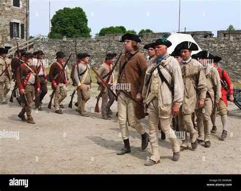 American Revolutionary War Reenactors Marching Out To Battle Stock