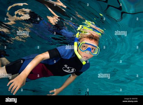 Boy Swimming With Snorkel In Pool From Underwater Stock Photo Alamy