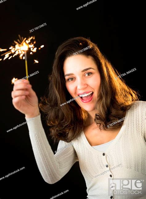 Woman Holding Sparkler Stock Photo Picture And Royalty Free Image