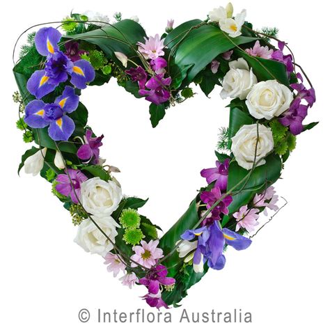 Heart Shape Wreath Available In White Pink And Yellow Flowers