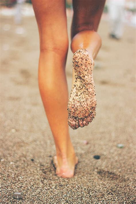 Female Feet On The Beach Covered In Sand By Stocksy Contributor Jovana Rikalo Summer