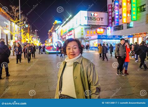 Portrait Photo Asian Women Traveler Smile And Standing On Wangfujing