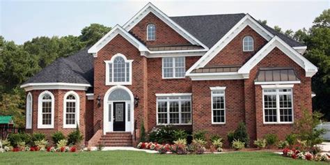 White washed bricks with a lighter cream colored stucco walls (dsldhomes.com). Stucco vs Brick - Pros, Cons, Comparisons and Costs