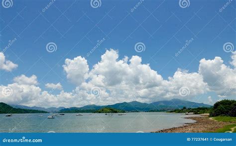 Green Mountain Lake Boat Blue Sky And White Cloud Stock Image