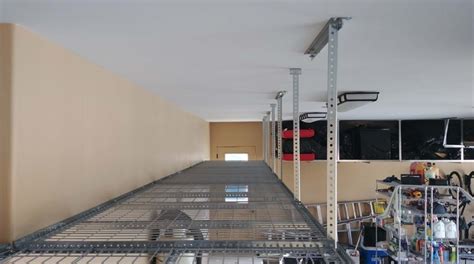Overhead diy garage storage system tuck medium and lightweight stuff onto shelves suspended from the ceiling. Overhead Garage Storage Racks Pricing Gallery