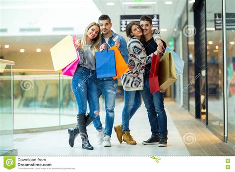 Group Of Friends Shopping In Mall Together Stock Image Image Of Sale
