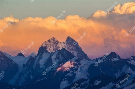 Premium Photo Photo Of Beautiful Mountains At Sunset In The Clouds
