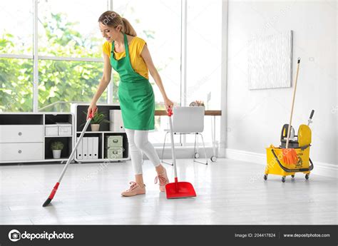 Young Woman Broom Dustpan Cleaning Office Stock Photo By ©newafrica