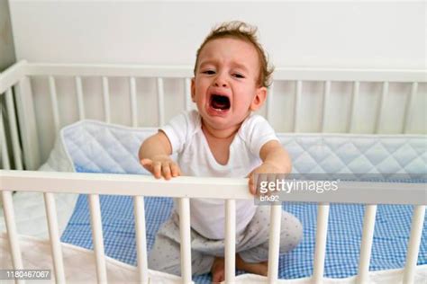 Crying Baby In Crib Photos And Premium High Res Pictures Getty Images