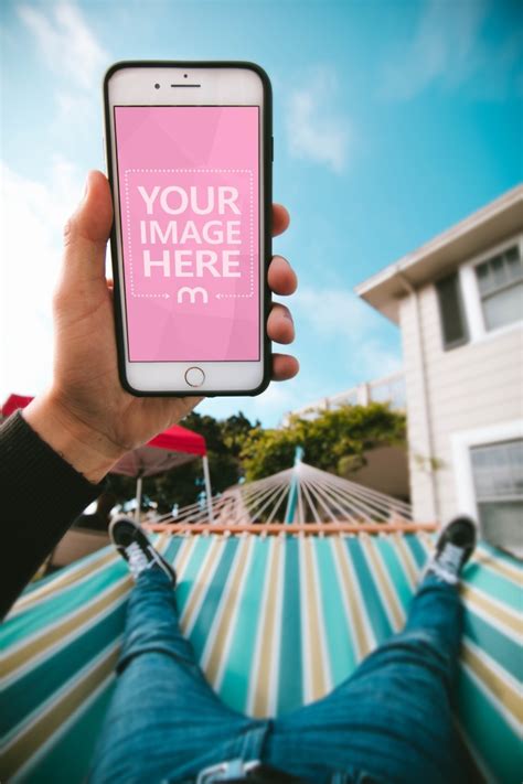 Download Man Using iPhone on a Hammock Mockup Generator - Mediamodifier