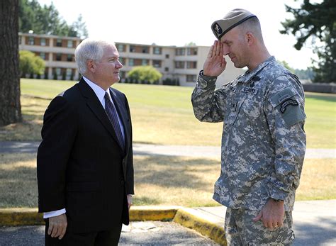 Defense Secretary Robert M Gates Receives A Salute From Us Army Col