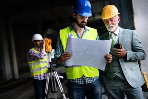 Confident Team Of Architects And Engineers Working Together On