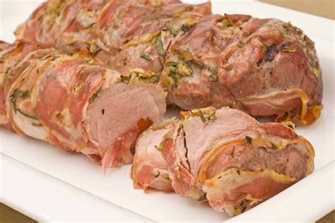 Pork Tenderloin Rubbed With Fresh Rosemary And Garlic Then Wrapped In