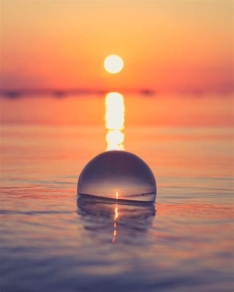 Quiet Ocean Waves Surrounding The Lensball During Sunset Incredible