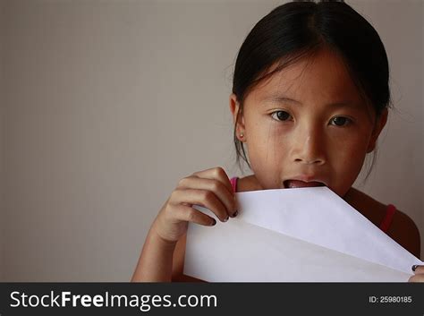 Little Asian Girl Licking A Envelope Free Stock Images And Photos