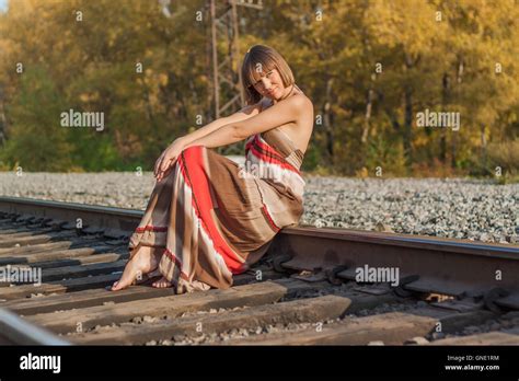 Beautiful Girl Sitting On Railroad Track Stock Photo Alamy