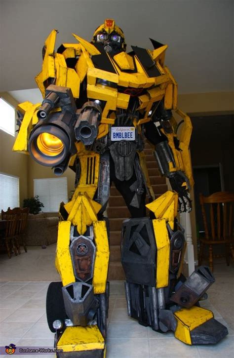 A Large Yellow And Black Robot Standing In A Living Room Next To A