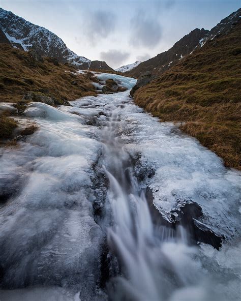 Water Flows Through A Melting Mountain License Image 70521533