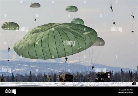 Us Army Paratrooper Soldiers Parachute During An Airdrop Exercise April