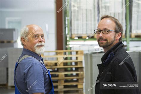 Factory Worker With Supervisor — Colleague Mature Man Stock Photo