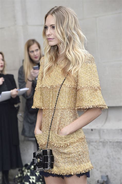 poppy delevingne shows off her long layered haircut at paris fashion week glamour