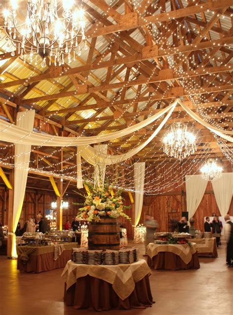 romantic indoor barn wedding decor ideas  lights deer pearl flowers