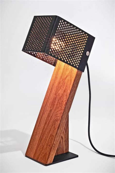 The led light source consumes up to 85% less energy and lasts 20 times longer than incandescent bulbs. Handcrafted Oblic Wood Table Lamp • iD Lights