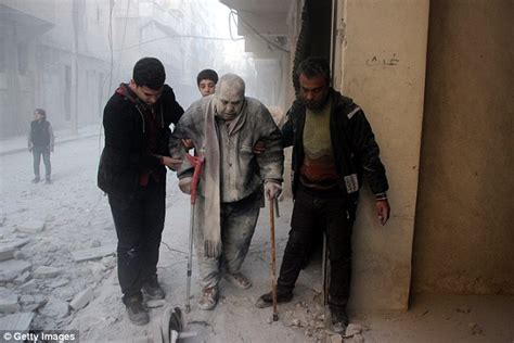 Photos Show Syrian Man Covered In Ash After Aleppo Is Hit By Airstrikes