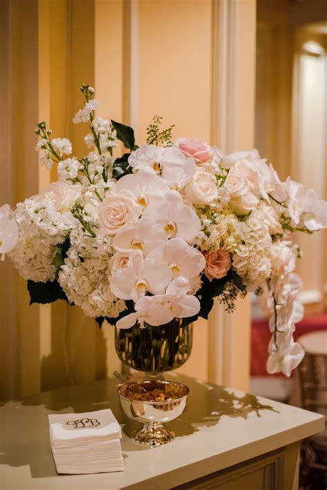 Flower Arrangement With Orchids And Roses