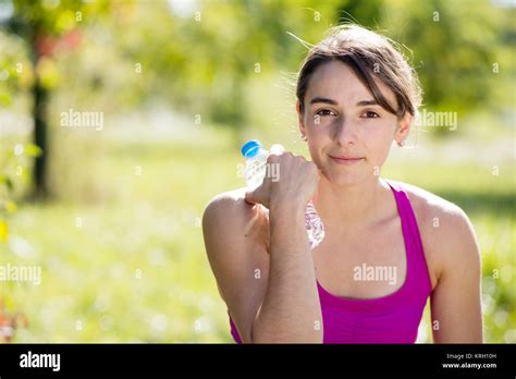 Athletic Girl Drinking Water After Exercising Stock Photo Alamy
