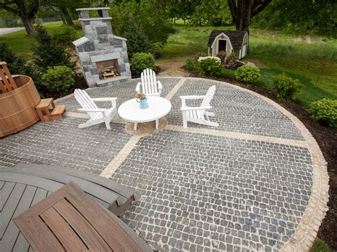 Lay 1 to 2 rows of patio stones. How to Install a Cobblestone System | how-tos | DIY