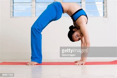 Portrait Of A Young Woman Bent Over Backwards Photo Getty Images