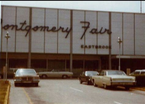 Cars Parked In Front Of A Building With The Words Montgomery Fair On It