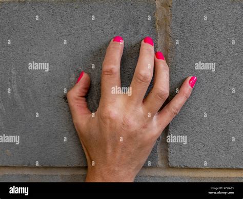 Hand With Red Fingernails Scraping On Wall Stock Photo Alamy