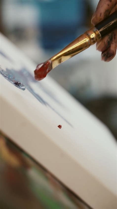 Close Up View Of A Person Painting On Canvas · Free Stock Video