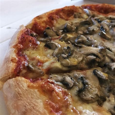 Funghi Pizza with mushrooms and egg